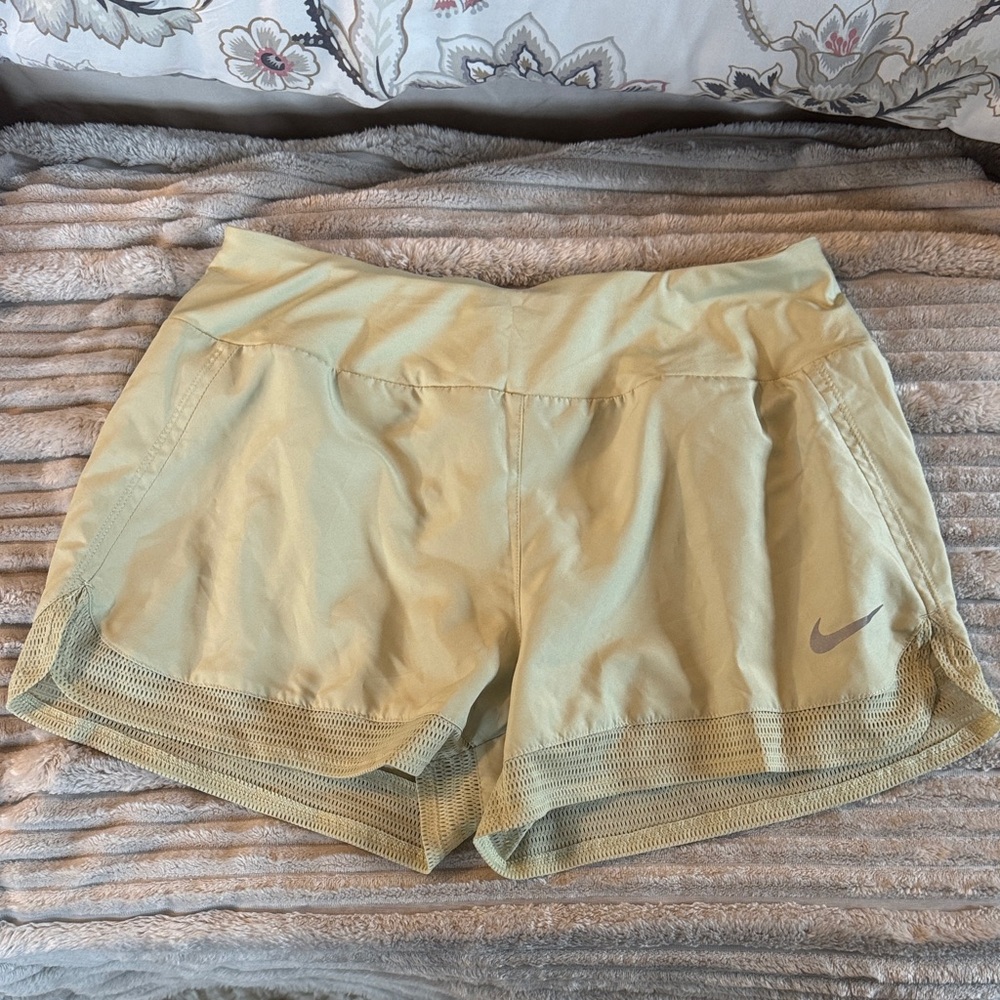 Nike Women’s Light Green Athletic Shorts with Mesh Hem